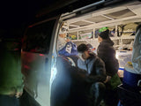  and a portable fridge between them