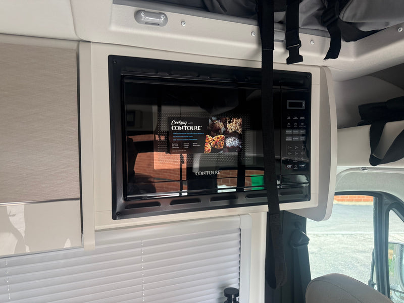 Compact Contoure microwave oven inside an RV rental, ready for convenient cooking during your travel adventures. — photo 3