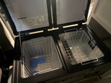 Open dual-zone portable fridge/freezer with wire baskets and ice packs, ideal for your RV rental or camping adventure.