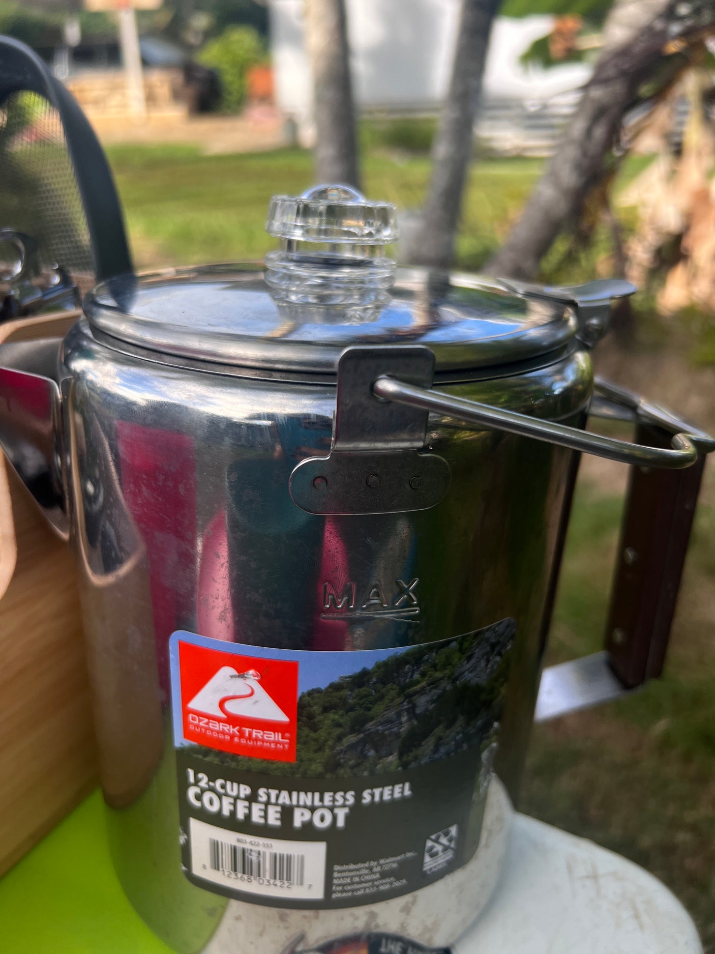 An Ozark Trail stainless steel coffee pot, ready for your RV rental camping adventure.