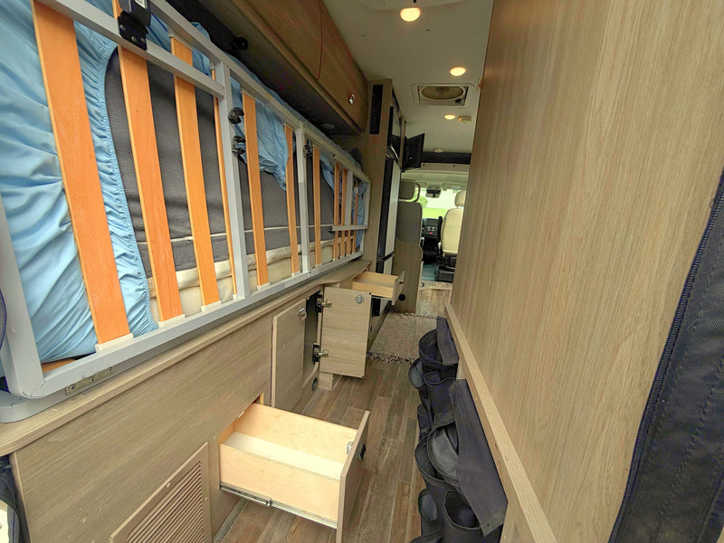  and adjustable dining table.|Driver's dashboard of an RV rental: view includes steering wheel — photo 9