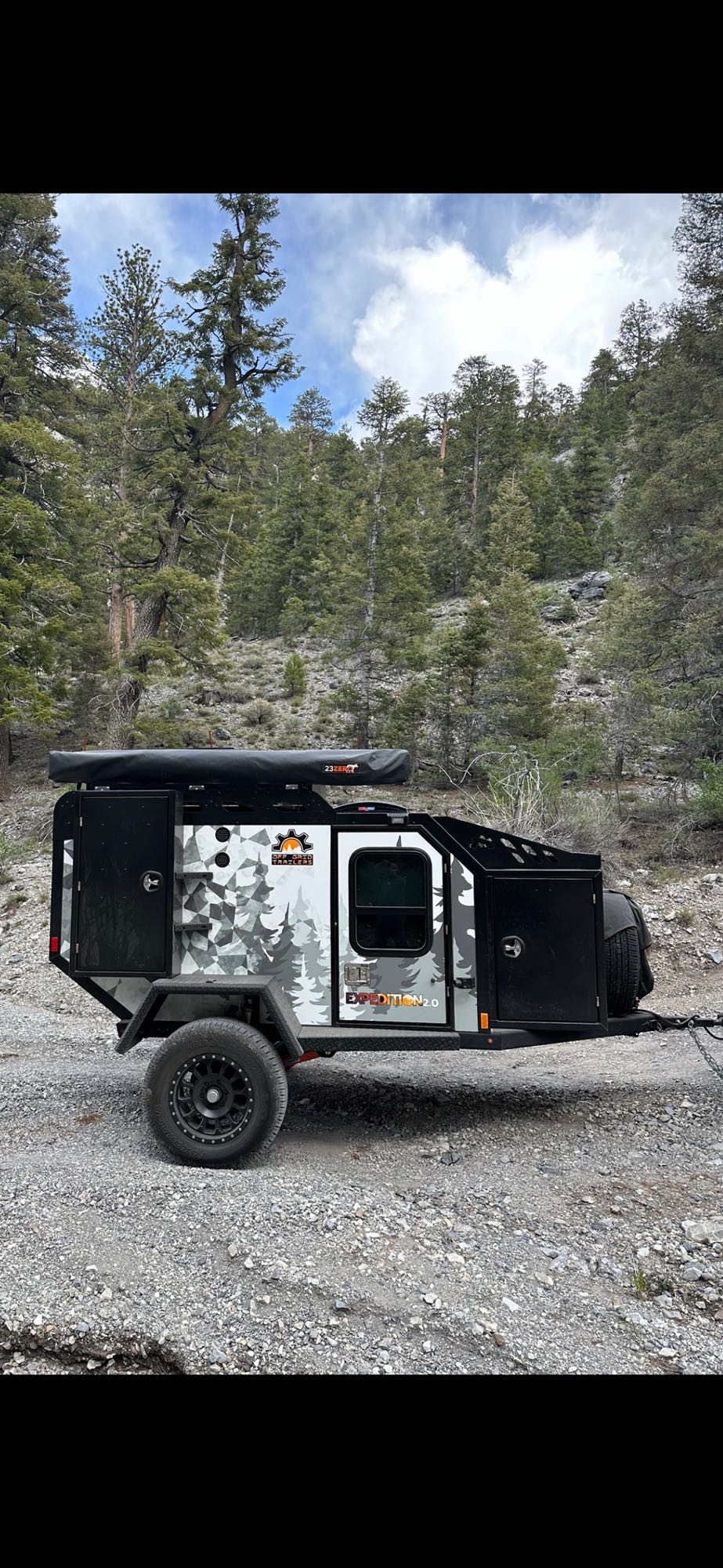 Off-Grid Expedition 2.0 trailer, ideal for your rugged RV rental adventure in the mountainous forest. — photo 14
