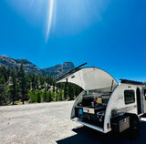 Sunny mountain stop with our Luna Rover rv rental. This tear-drop camper's outdoor kitchen is perfect for adventure cooking.