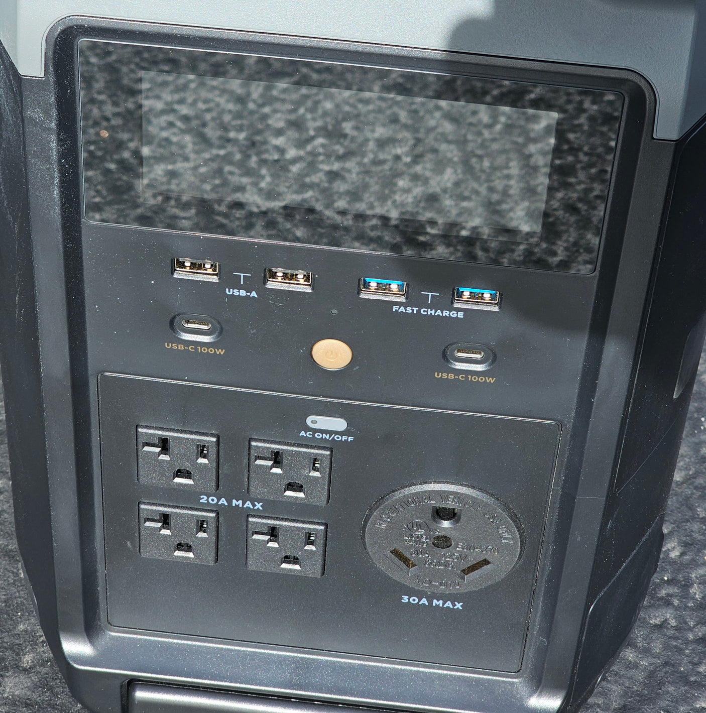 A portable power station's front panel shows USB-C, USB-A, AC, and 30A RV outlets, ideal for your rv rental power needs.