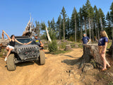 Four friends on an off-road Jeep adventure in the woods. Explore nature, whether by Jeep or your next RV rental trip!
