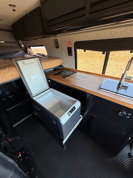  and storage.|Explore this RV rental's interior: a comfortable camper van bed — photo 7