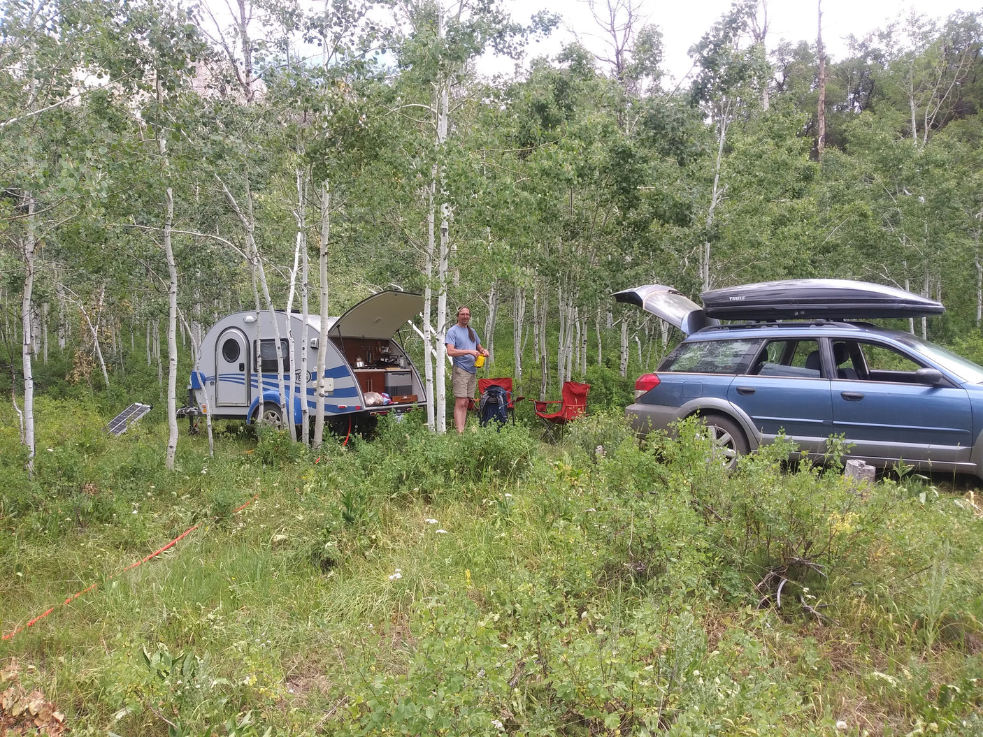 Outdoor camping with a compact RV rental & Subaru.