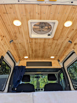 Experience comfort in this rv rental! Features a custom wooden ceiling, roof fan, and bright interior lights for your journey.