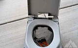 Clean waste folding camping toilet — used showers & toilets for sale
