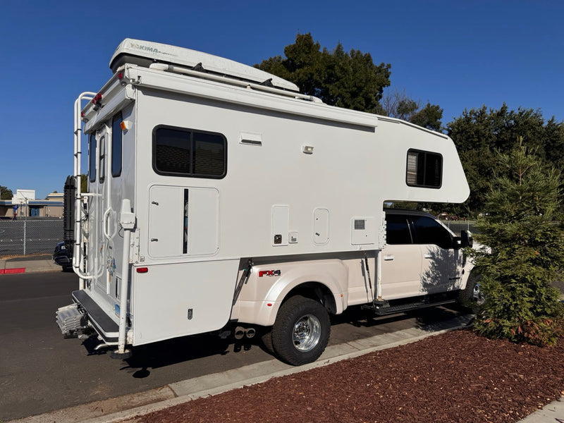  parked on a sunny street. Features a ladder — photo 7