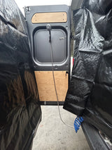 RV rental: Rear van doors with an outdoor shower and black privacy curtains, perfect for discreet bathing.