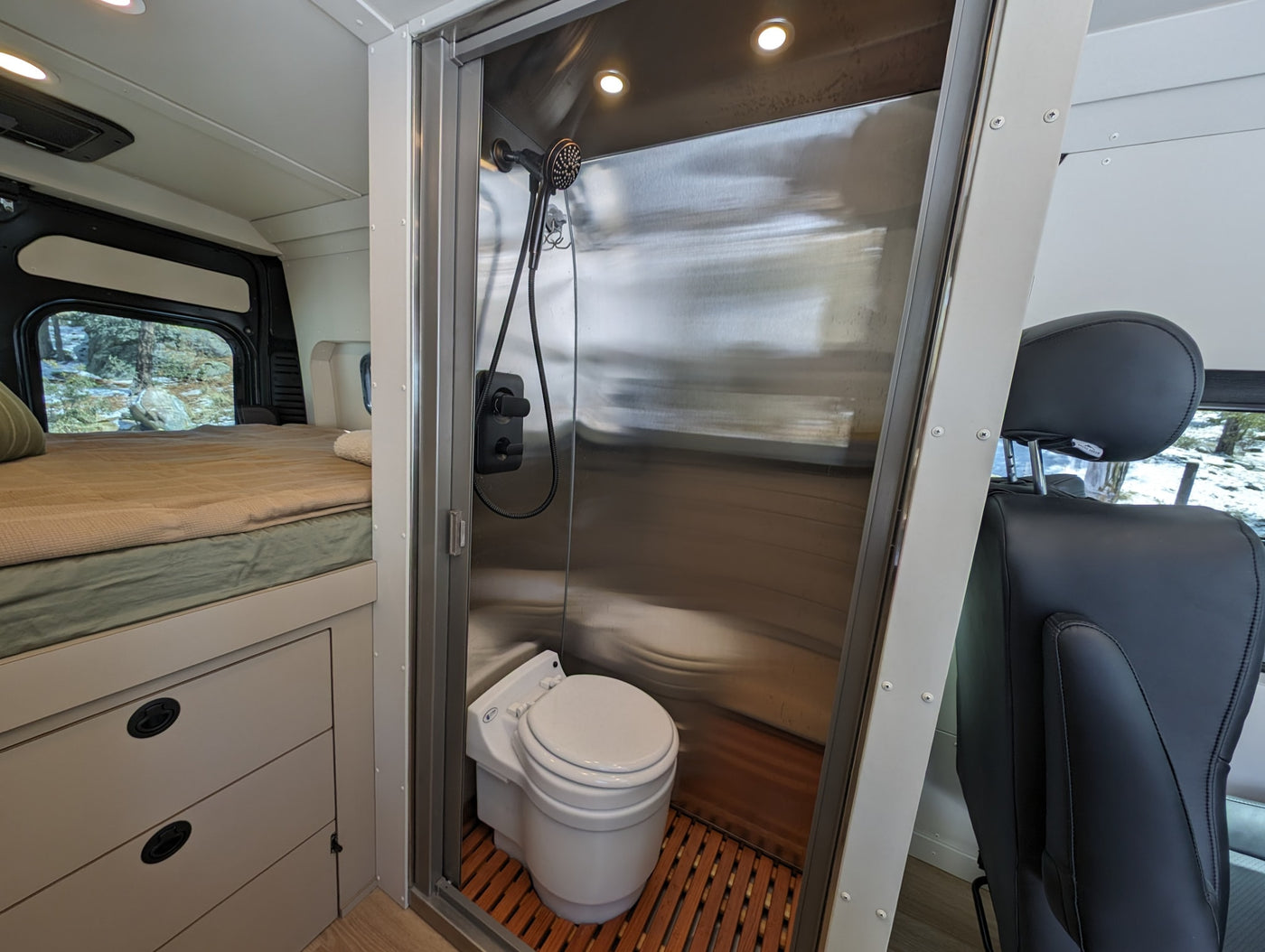  functional design.|Cozy rv rental interior featuring a comfortable bed — photo 9