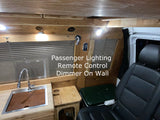 Discover this RV rental's cozy wooden interior featuring a sink, passenger seat, and dimmable lighting.