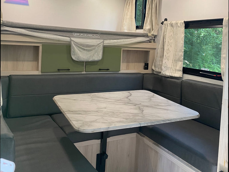  and a little girl pushing a wagon.|Cozy rv rental campsite with a Winnebago — photo 4