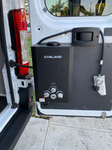 Portable GASLAND water heater installed in an RV rental van, ideal for outdoor showers.