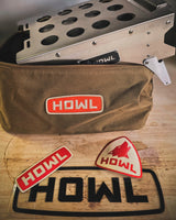 HOWL brand portable cooking gear (grill & storage bag) with stickers, ideal for your RV rental camping trips.