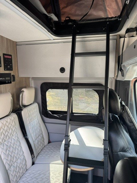  and an outdoor view. Ideal camper van for travel.|RV rental camper van interior: folded bed frame — photo 10