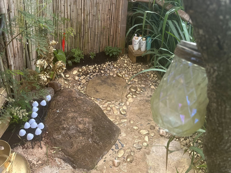  alongside our broader rv rental selection.|Outdoor KitchenAid grill & Primo water dispenser set up with a table amidst nature. Perfect for an RV rental getaway!|Cozy outdoor seating amidst tropical plants — photo 11