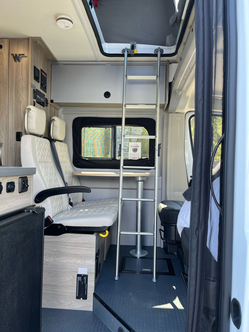 and adaptable seating.|RV rental interior features comfortable quilted seats — photo 7