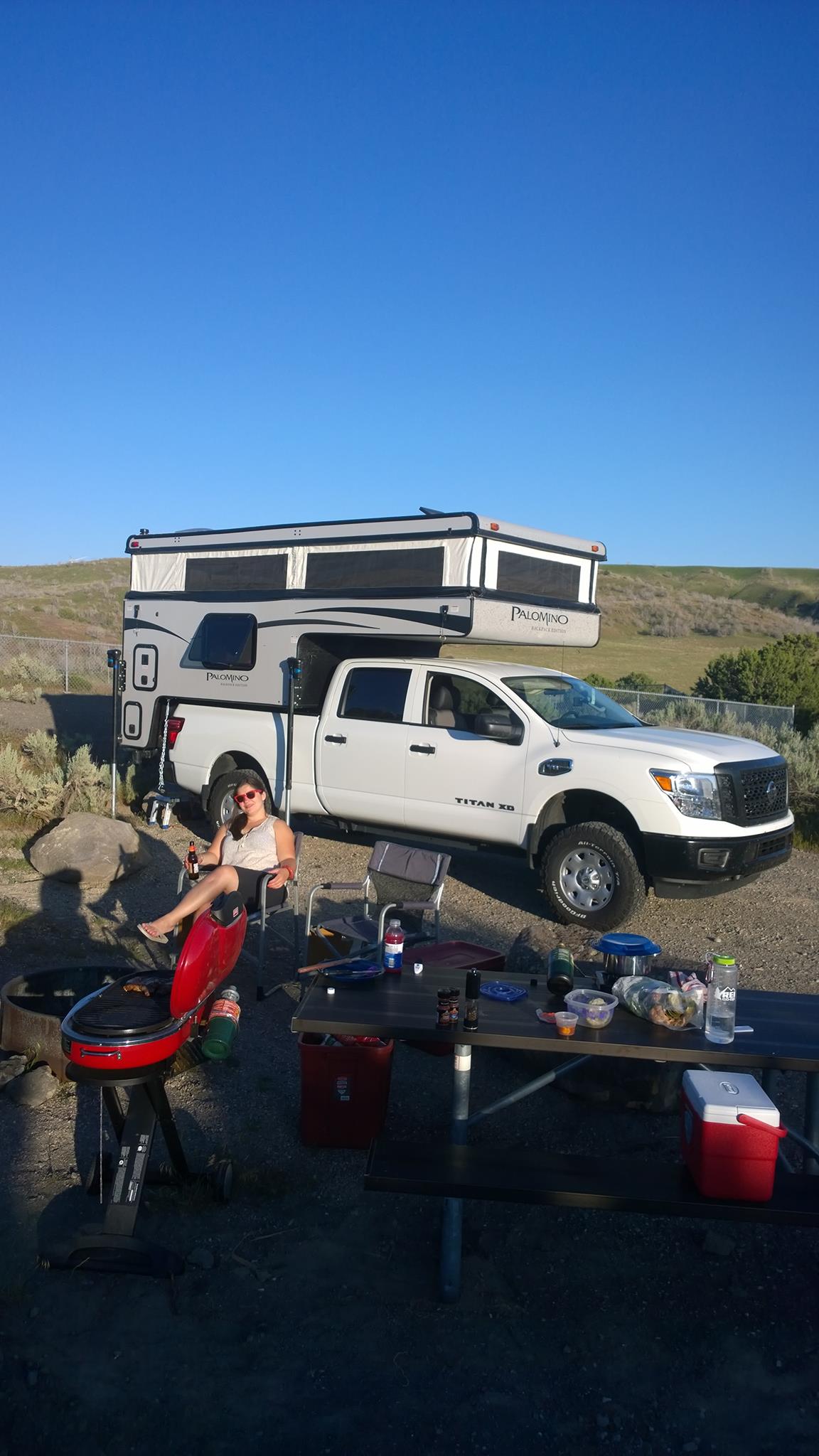  parked by desert sand dunes.|Breakfast inside an RV rental: Two bowls of cereal — photo 9
