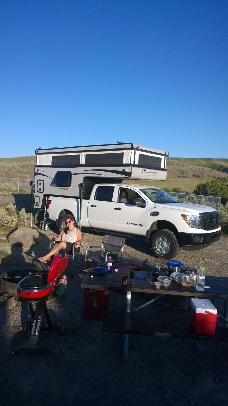  parked by desert sand dunes.|Breakfast inside an RV rental: Two bowls of cereal — photo 9