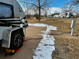 An rv rental, a Boondock Lite teardrop trailer, powered up at a snowy RV park site 38. Ready for adventure!