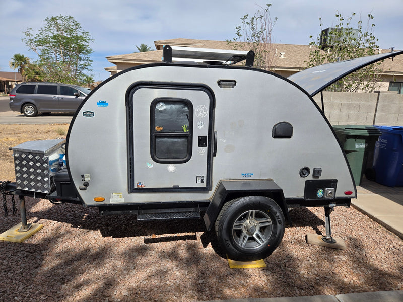 This Braxton Creek teardrop camper, perfect as an rv rental, features solar panels for your next outdoor adventure. — photo 1
