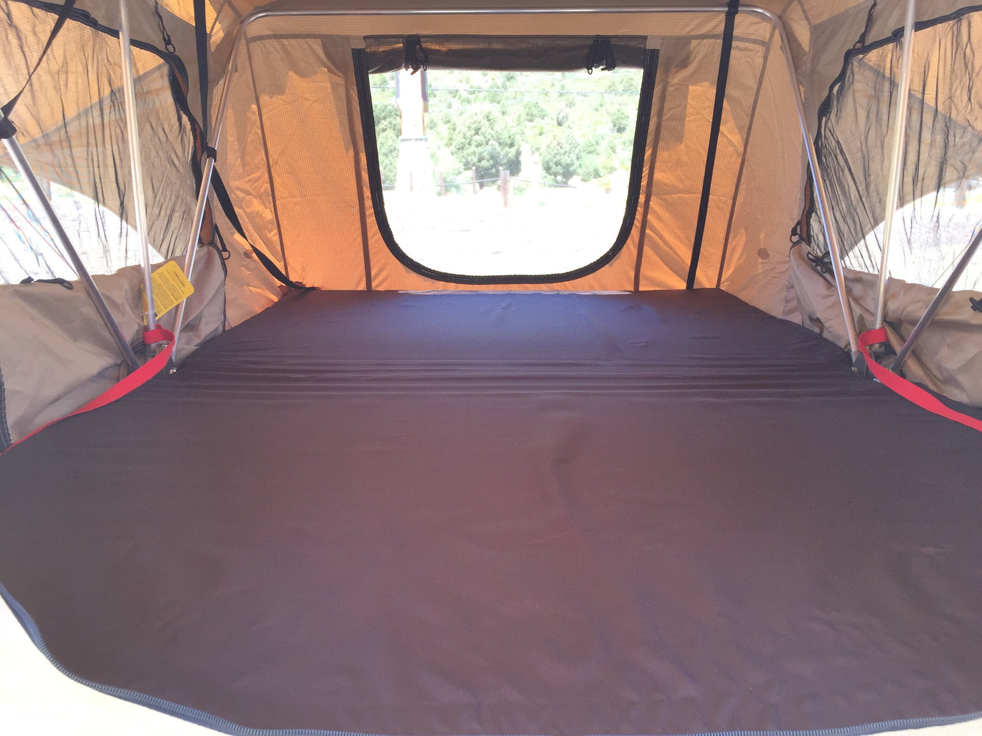  set up for camping near snowy mountains.|Explore nature with this rv rental! A minivan sports a rooftop tent — photo 10