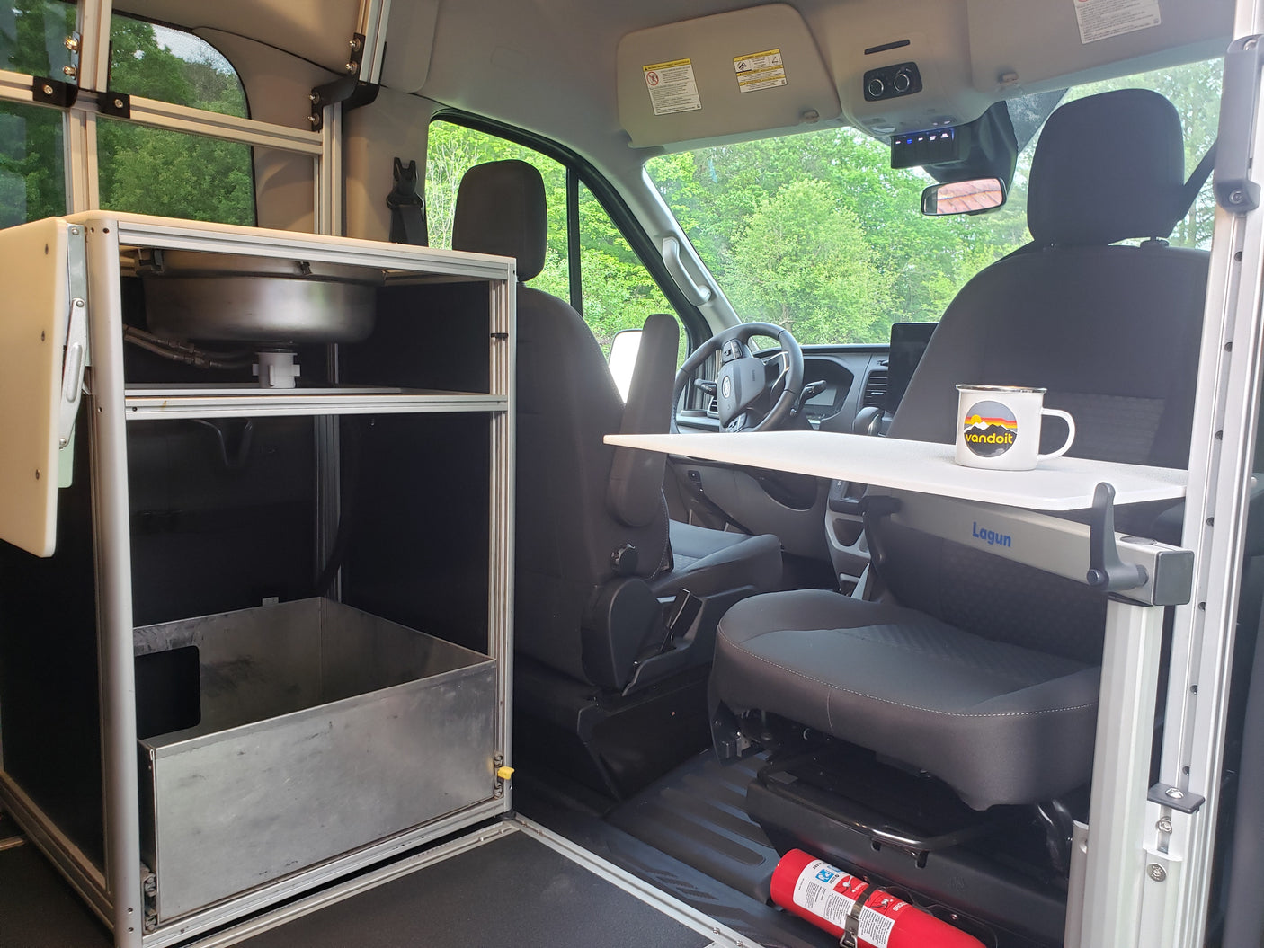 RV rental: Compact van conversion interior with a kitchen sink, versatile Lagun table, and front cabin area.