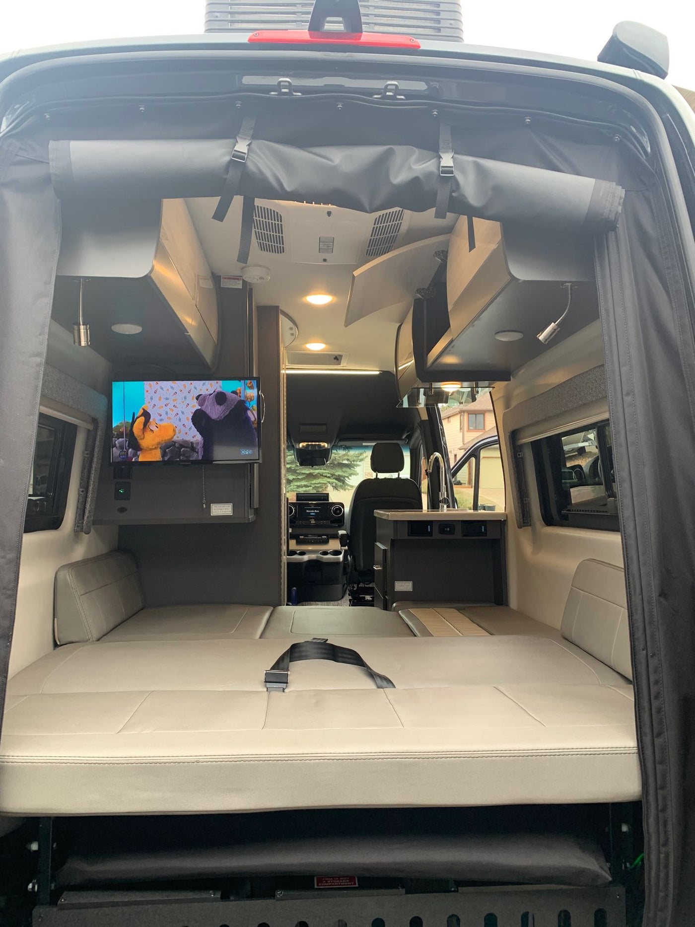  and microwave for travel.|Dark gray Mercedes Sprinter 4x4 camper van — photo 4