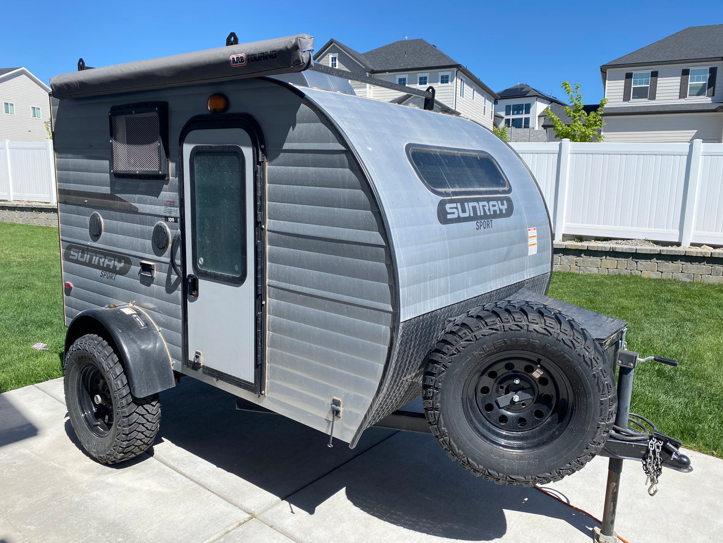 This rugged Sunray Sport off-road teardrop camper with an awning is ideal for an RV rental adventure.