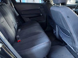 Rear vehicle interior featuring clean, comfortable back seats and seatbelts, ready for your RV rental road trip.
