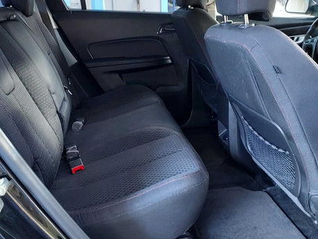 Rear vehicle interior featuring clean, comfortable back seats and seatbelts, ready for your RV rental road trip.