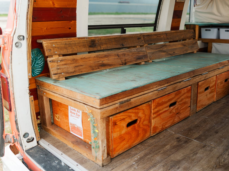  surrounded by organized bins and a cooler.|Woman arranges a cozy — photo 11