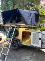 Explore the outdoors with this unique rv rental: a teardrop trailer featuring an iKamper rooftop tent. Ideal for camping!