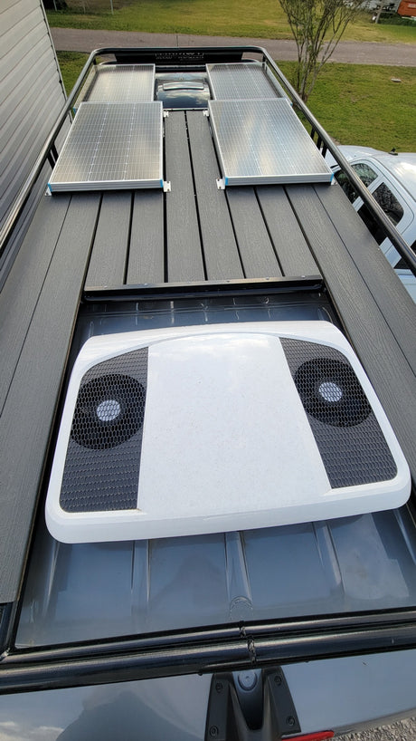 This RV rental is equipped with rooftop solar panels, an AC unit, and a sturdy deck, ideal for off-grid adventures.