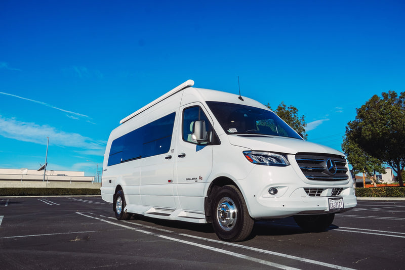 White Mercedes-Benz Sprinter RV rental parked in a sunny lot, ready for your next adventure. — photo 1
