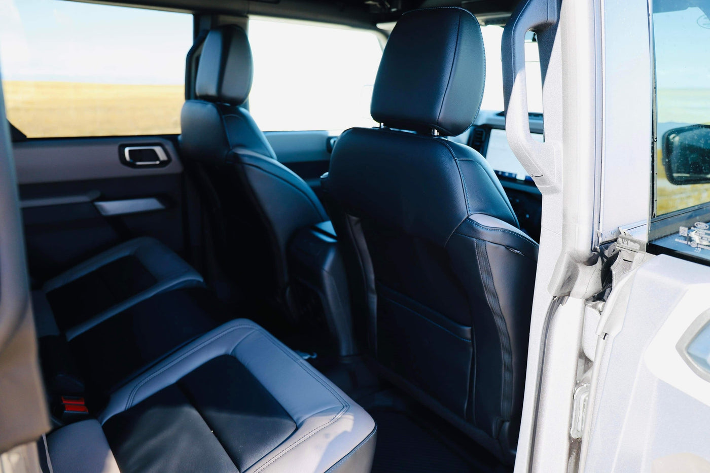 Back seats of a rugged SUV, ideal for your RV rental road trip. Enjoy the view through large windows. — photo 18