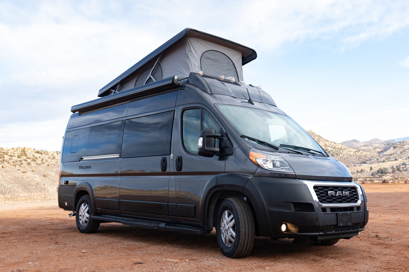 parked outdoors.|Dark grey Ram ProMaster camper van with a pop-top roof tent — photo 13