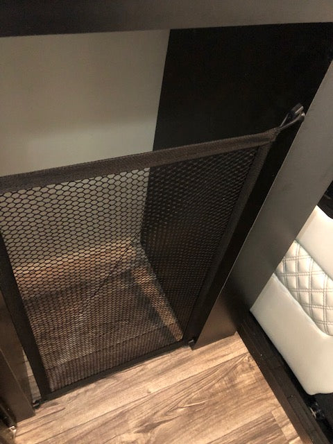 RV rental interior: View of a mesh storage net hanging via hooks from an overhead surface, for handy organization. — photo 13