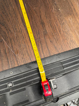 Measuring the spacious interior floor of an RV rental. Tape shows 71 inches (180 cm) on wood-look flooring.