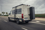  and ladder on a sandy coast.|Stylish RV rental: custom wood camper van interior with kitchen