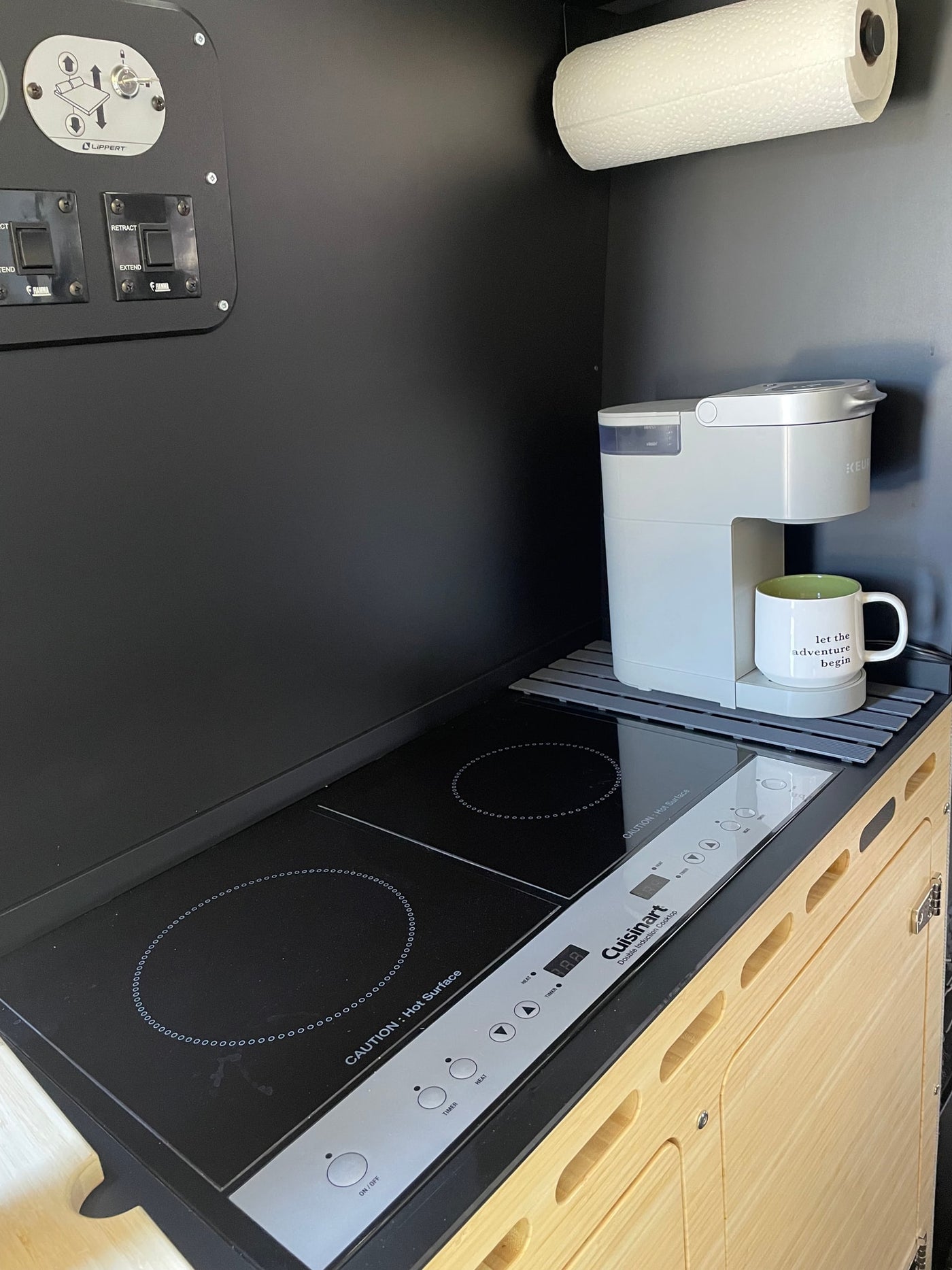  and ample storage for adventure gear.|Interior of a modern rv rental van. Features Mercedes-Benz dashboard — photo 15