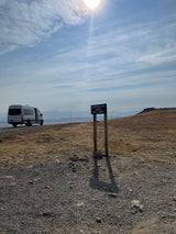 RV rental at Beartooth Pass Summit, elevation 10,947 feet, with scenic mountain views.