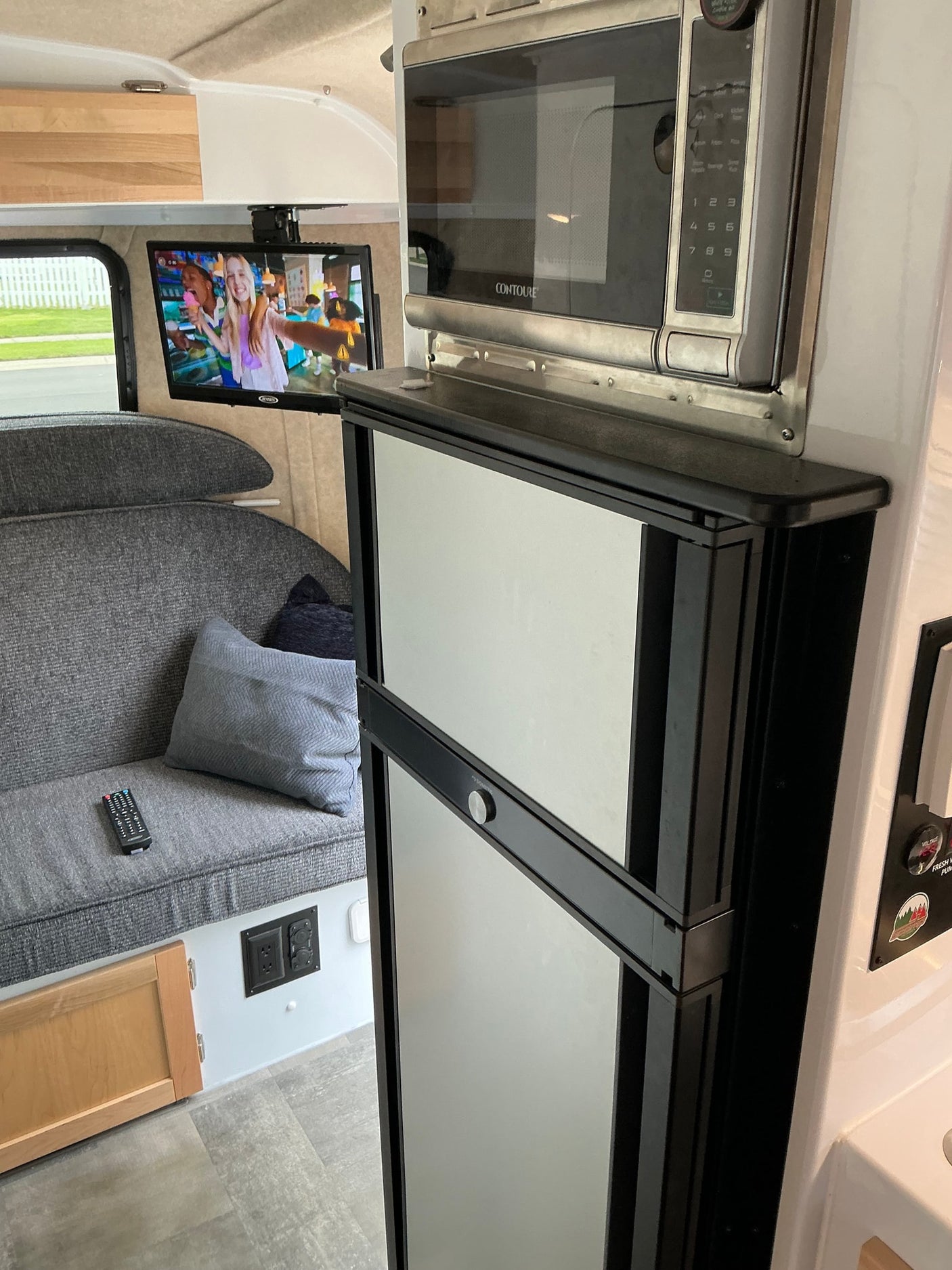  and rear camera.|A white Scamp travel trailer