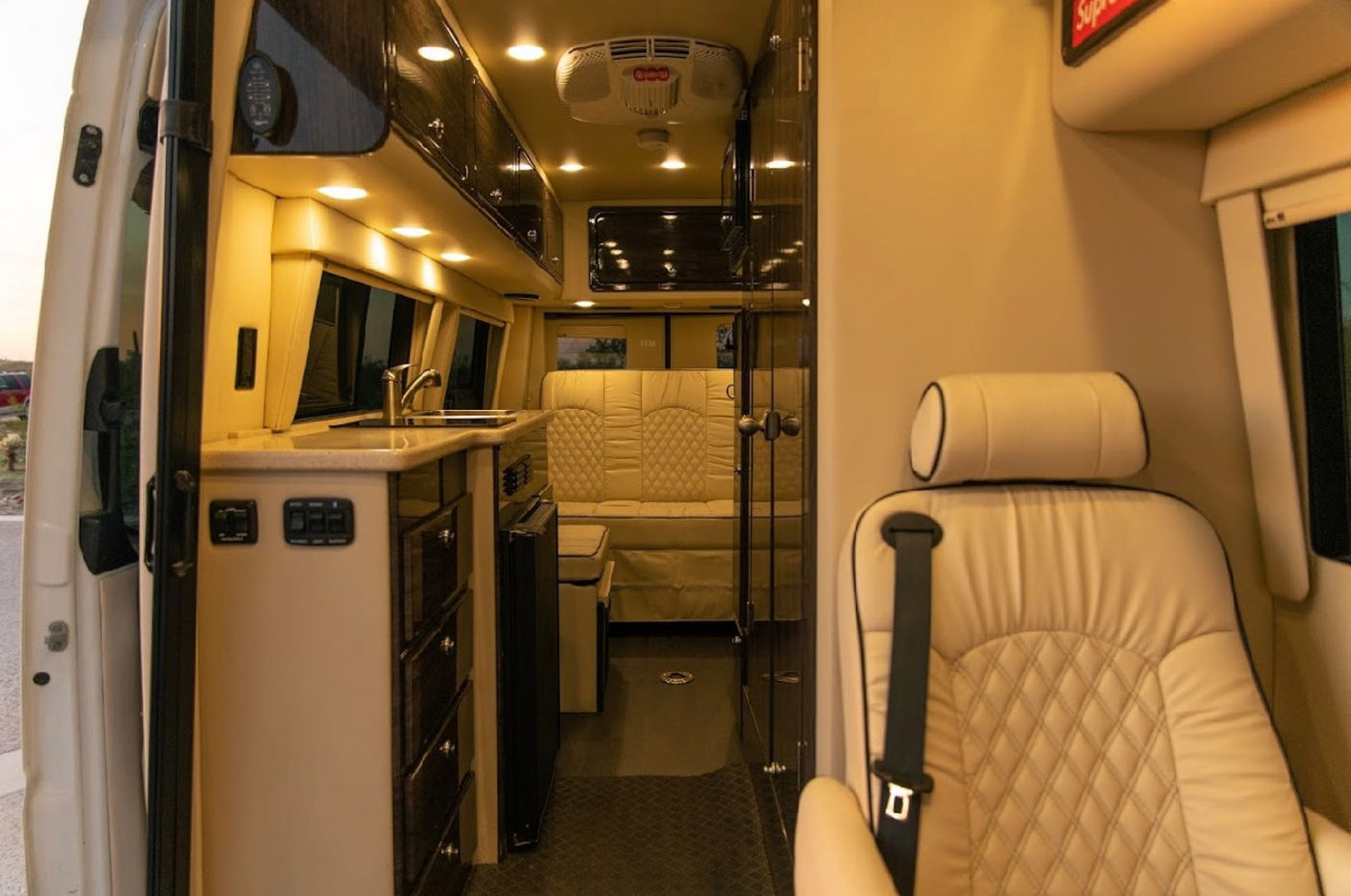  and desert views at sunset.|Step inside this modern RV rental featuring a full kitchen — photo 13