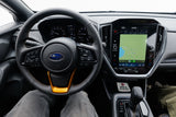 Inside a Subaru, showing the steering wheel, dash, and infotainment. Ideal vehicle for your next rv rental adventure!
