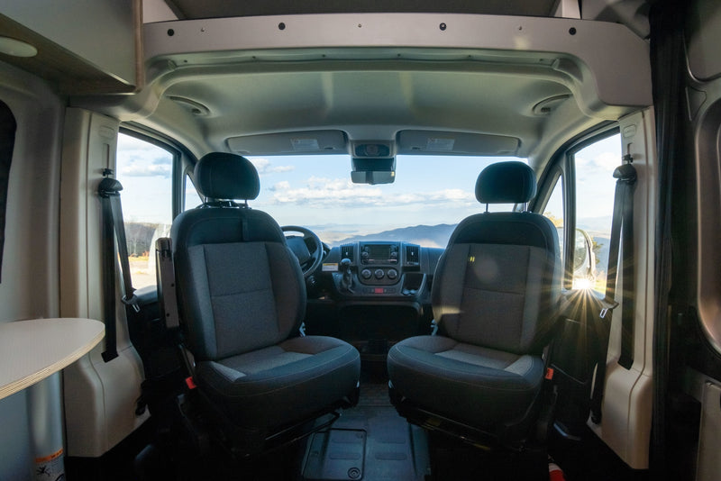  and stunning mountain views from its window.|Step inside this modern RV rental: a compact interior features a kitchenette — photo 7