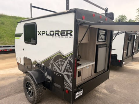 This Xplorer by Riverside RV travel trailer for rv rental features an outdoor kitchen, rugged wheels & roof rack for adventures.