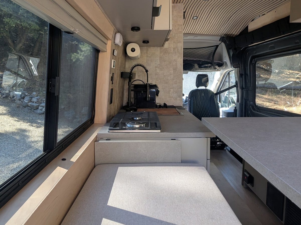  and integrated smart features.|Stylish RV rental interior with a modern kitchen — photo 9